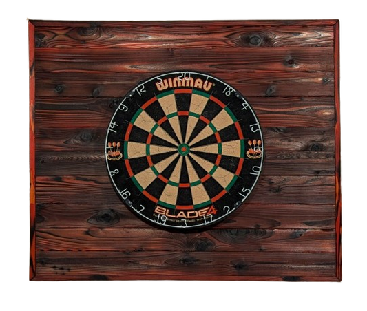 A dartboard backboard done using the shou sugi ban technique