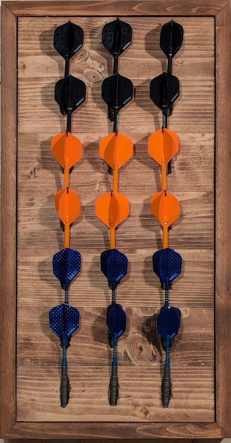 A Barn Board darts holder, made of reclaimed wood, than can display 6 sets of darts (18 darts). Featured a French cleat system to facilitate mounting on a wall.