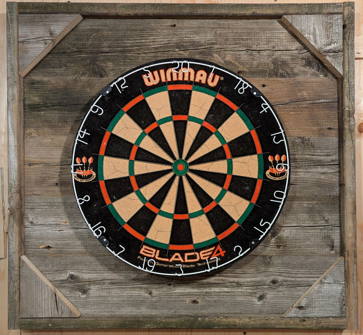 Made from reclaimed wood, this backboard offers indoor or outdoor use. A perfectly centered bracket makes for easy mounting of the dartboard. A French cleat facilitated hanging.