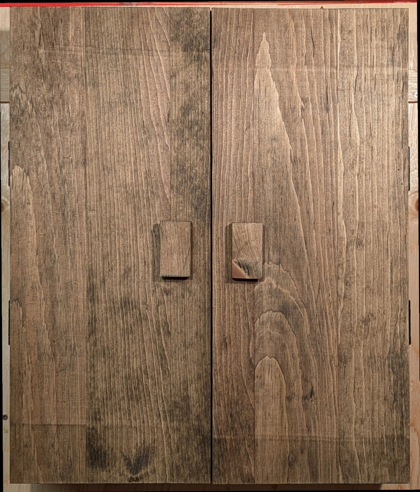 A solid pine darts cabinet finished with a special a Special Walnut color.