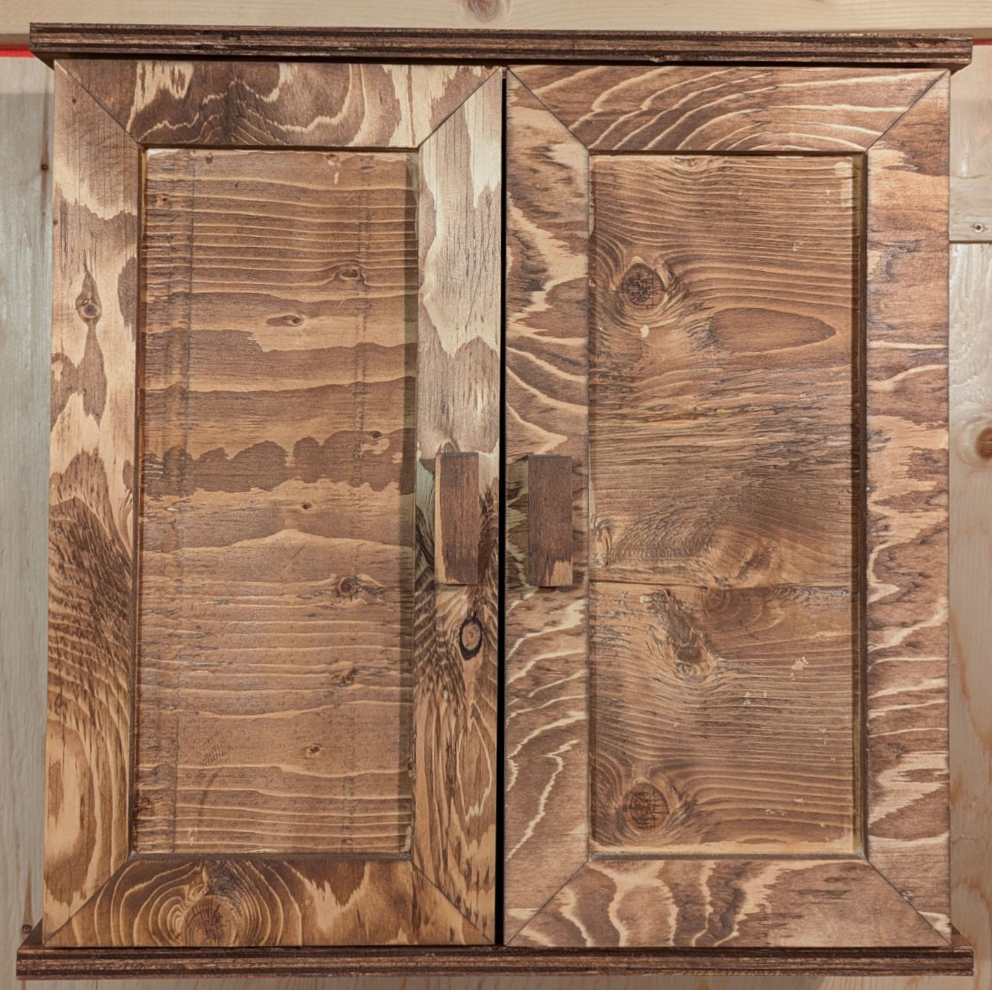 A solid wood dartboard cabinet finished in a special walnut color