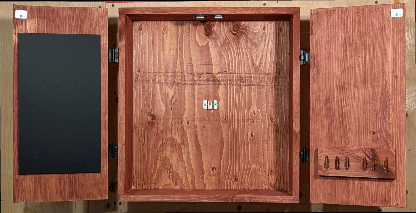 A dartboard cabinet featuring latches for the doors, a perfectly centered dartboard bracket, a scoreboard and a darts holder for 2 sets of darts (6 darts). Finished in Sedona Red.
