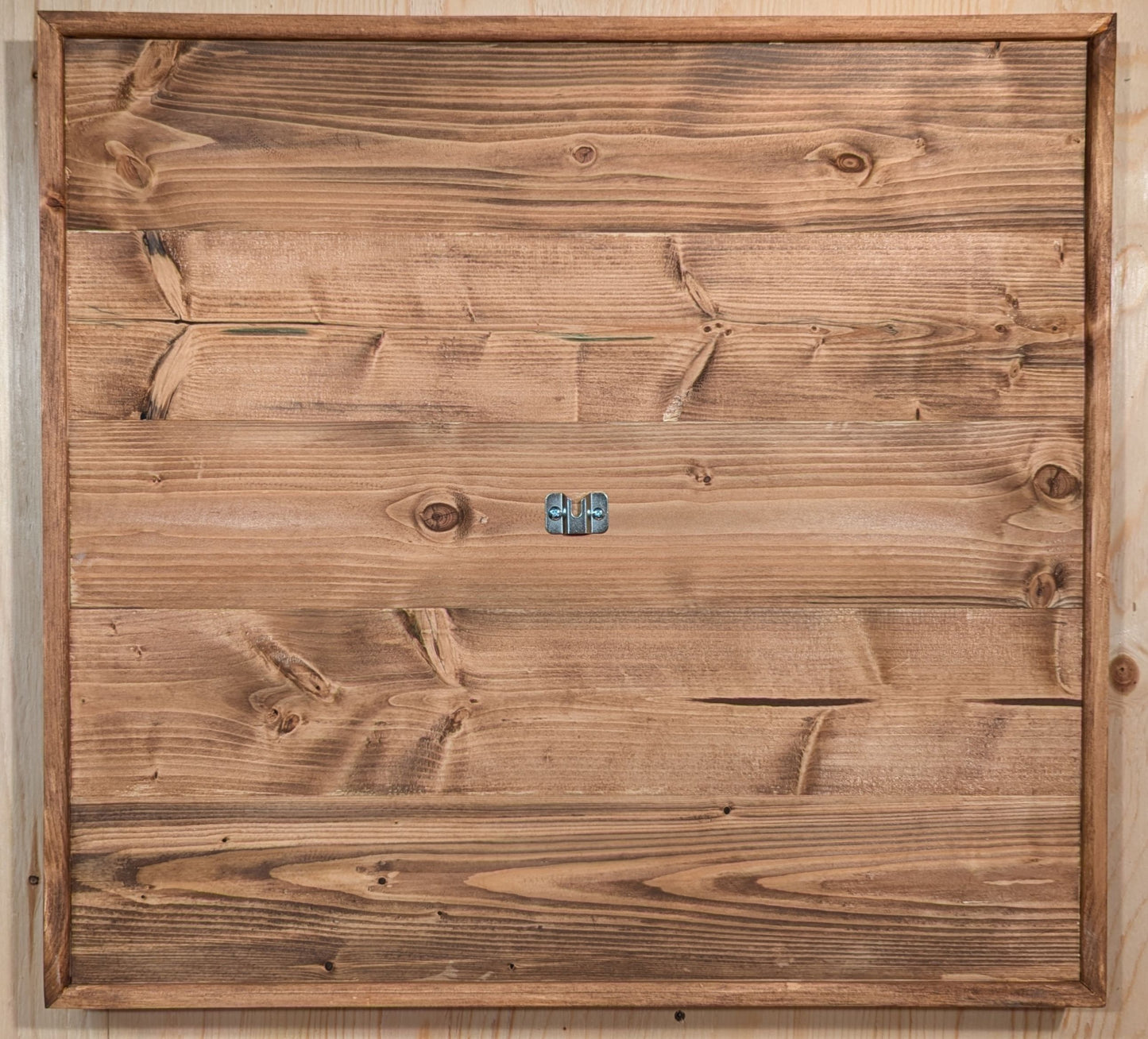 A darts backboard finished in special walnut. The perfectly centered dartboard bracket in on display.