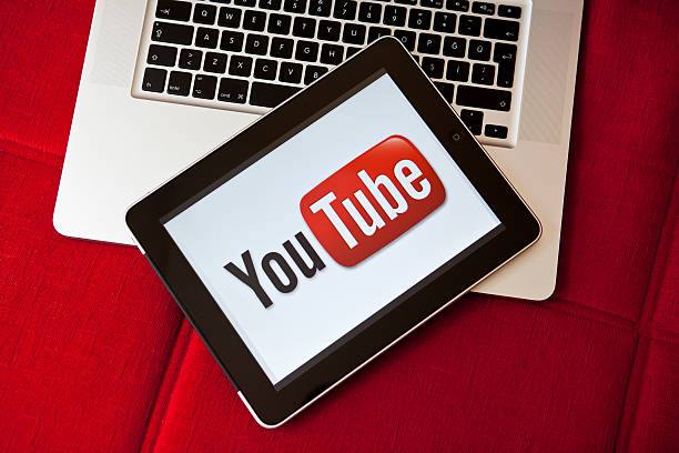 A laptop and tablet with the YouTube logo.