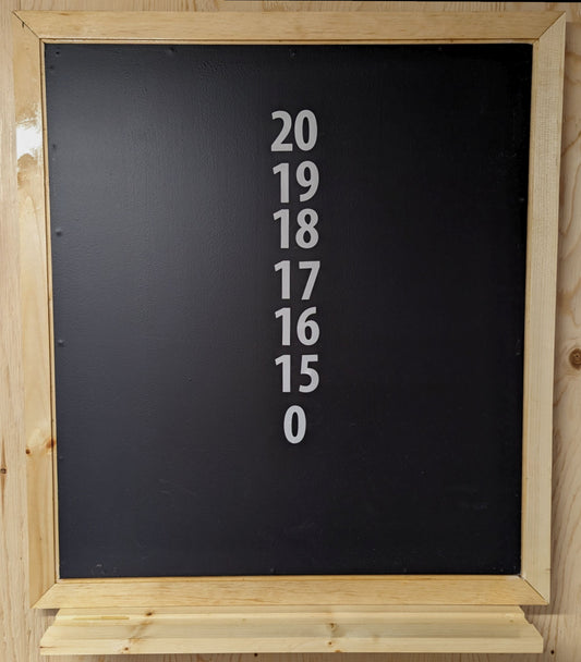 A solid pine scoreboard with high gloss finish featuring a ledge for chalk and brush.