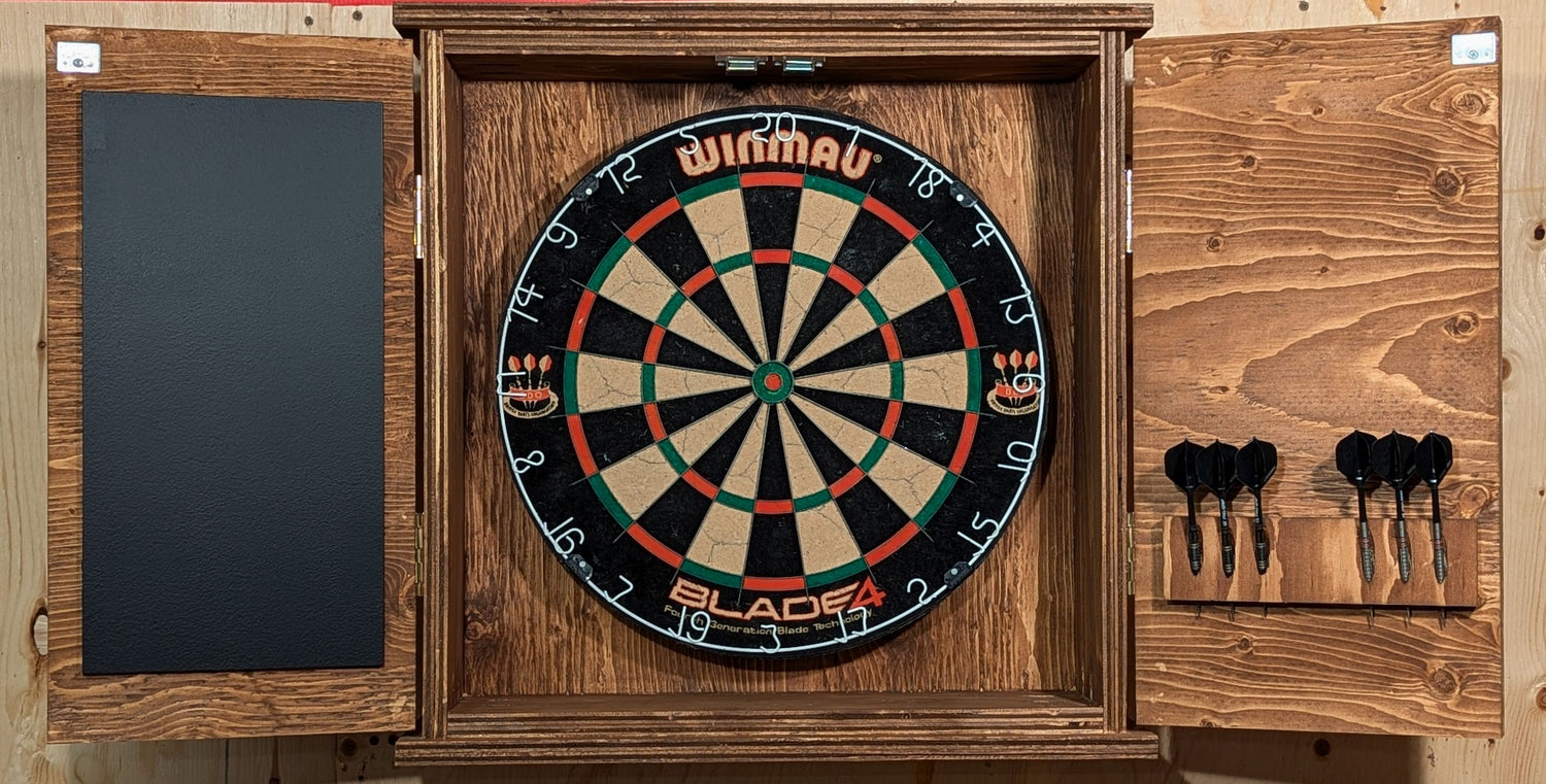 A darts cabinet featuring a scoreboard and darts holder for 2 sets of darts (6 darts). Finished in a Special Walnut color.