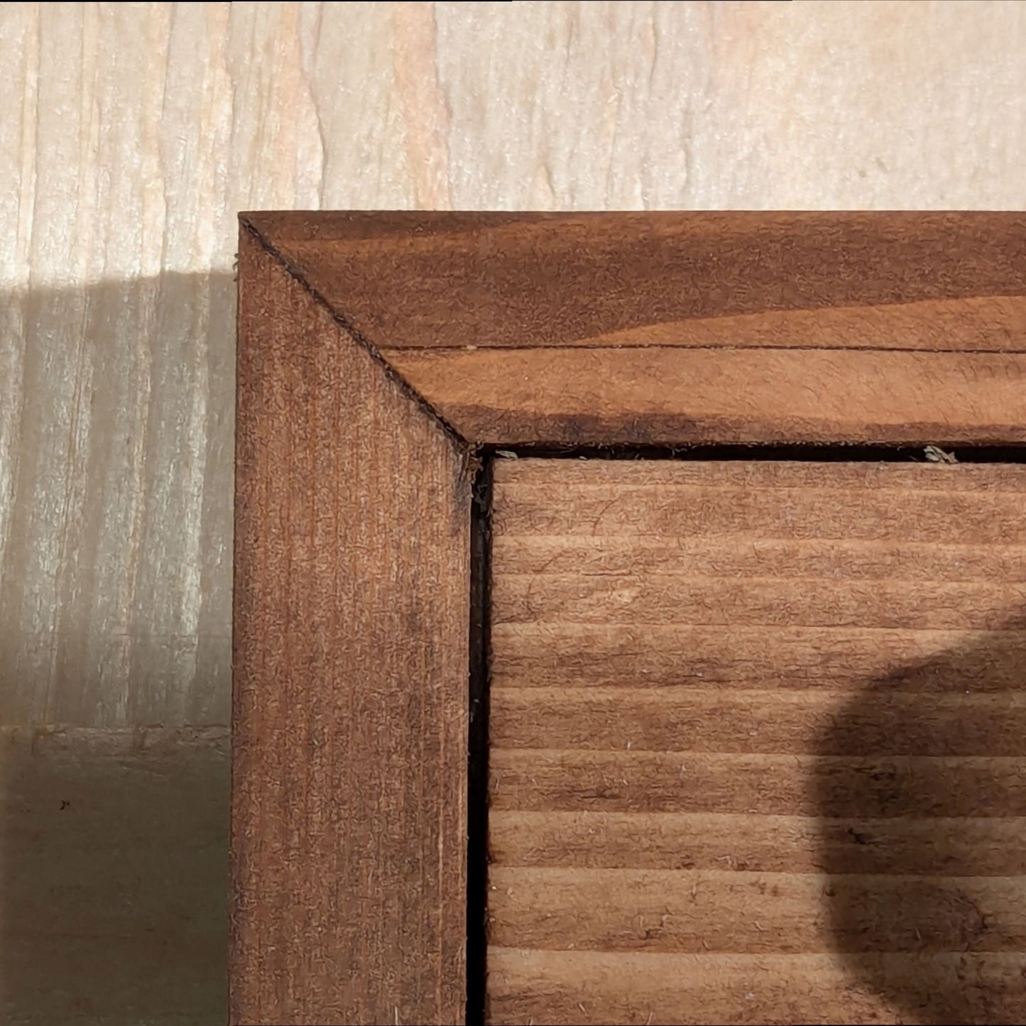 The Tungsten Tableau darts holder features mitered corners. The holder is finished in Special Walnut.